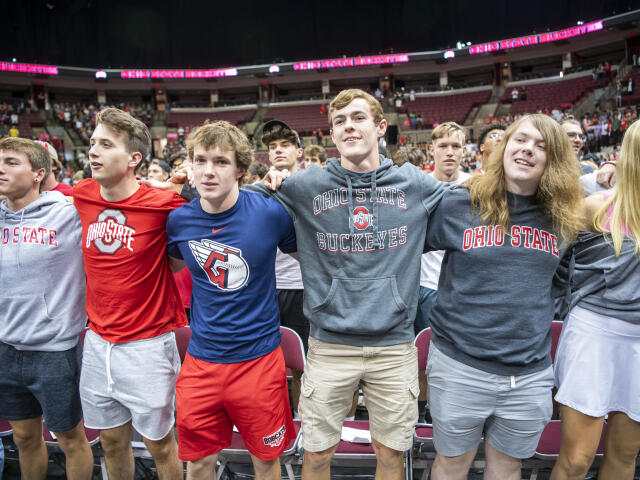 How firm thy friendship... students standing arm and arm